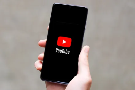 Phone-in-hand-showing-YouTube-logo.jpg