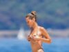 Bella Hadid mostra seu físico de cair o queixo em um biquíni marrom enquanto toma banho de sol em um iate em Cannes