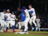 Streaking Cubs, derrubando Reds para colidir em Chicago