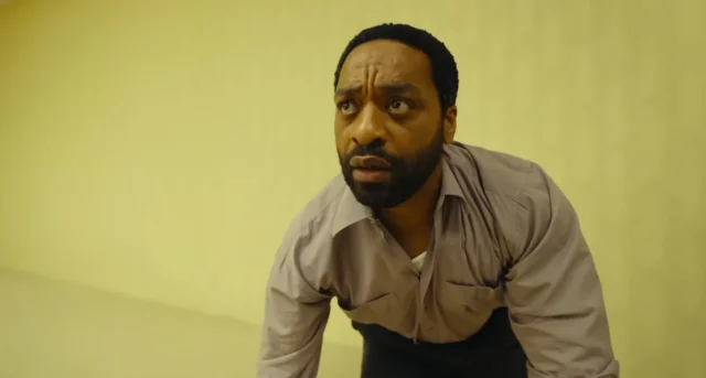 Chiwetel-Ejiofor-looking-astonished-in-Backrooms-the-horror-film-directed-by-Kane-Parsons-and-produc.webp