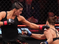 Ronda Rousey para Gina Carano com um armlock aos 17 segundos de luta dupla de retorno
