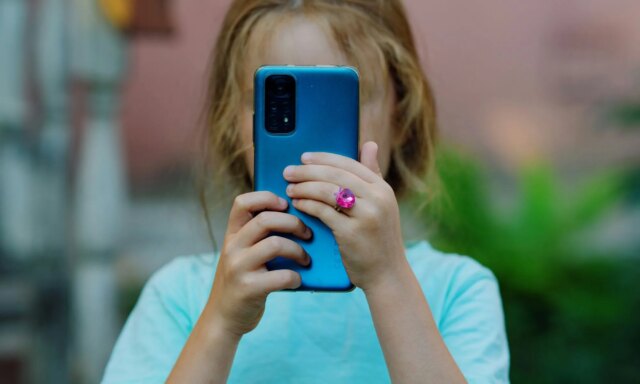 Child-using-a-blue-phone.jpg