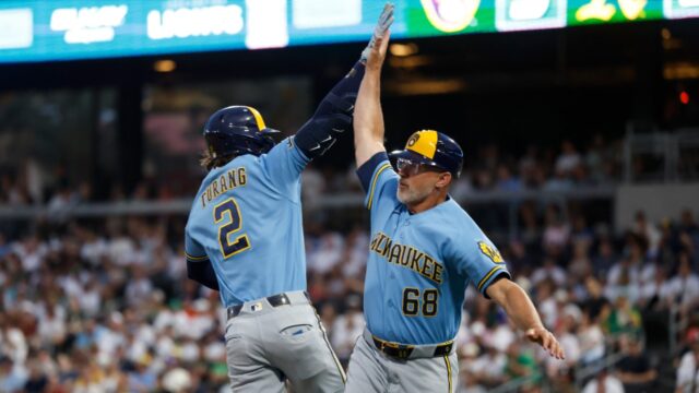 Milwaukee-Brewers-Brice-Turang-2-is-greeted-by-third-base-coach-Matt-Erickson.jpg