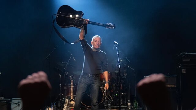 bruce-springsteen-holding-up-his-guitar.jpg